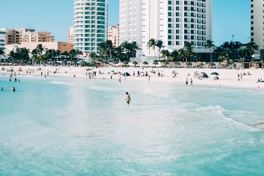 Beachfront towers and turquoise water along the coast